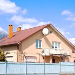 A private suburban house with a custom fence in an eco-friendly cottage community.