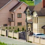 A new two-story cottage enclosed by durable vinyl fencing materials for privacy and style.